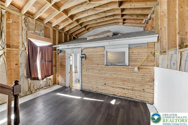 a view of a porch with wooden floor