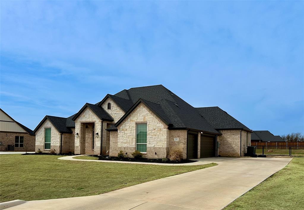 a front view of a house with a yard