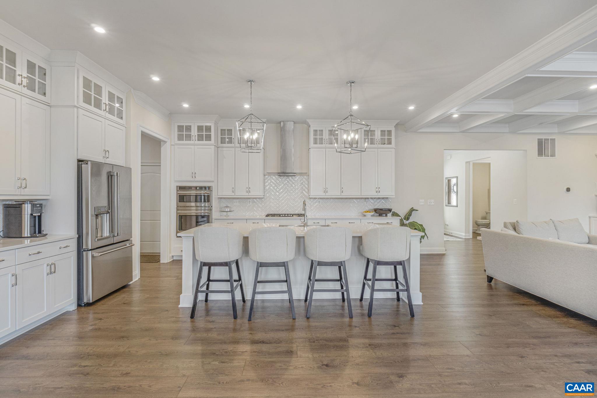 3624 Osprey Drive Keswick, VA 22947 - Photo 15 of 68 a large kitchen with stainless steel appliances lots of white furniture appliances and a dining table