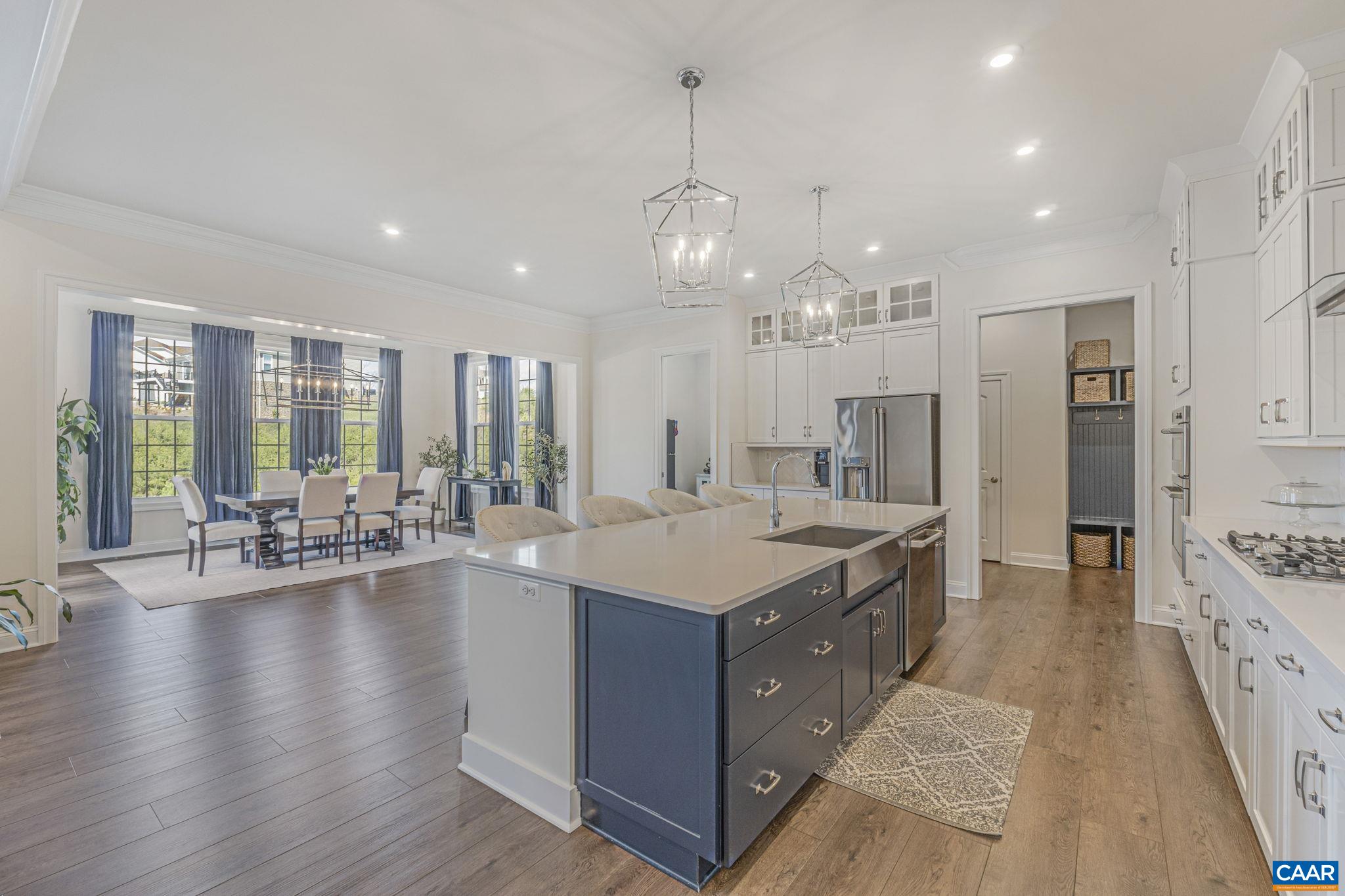 3624 Osprey Drive Keswick, VA 22947 - Photo 16 of 68 a large kitchen with kitchen island a large island in it