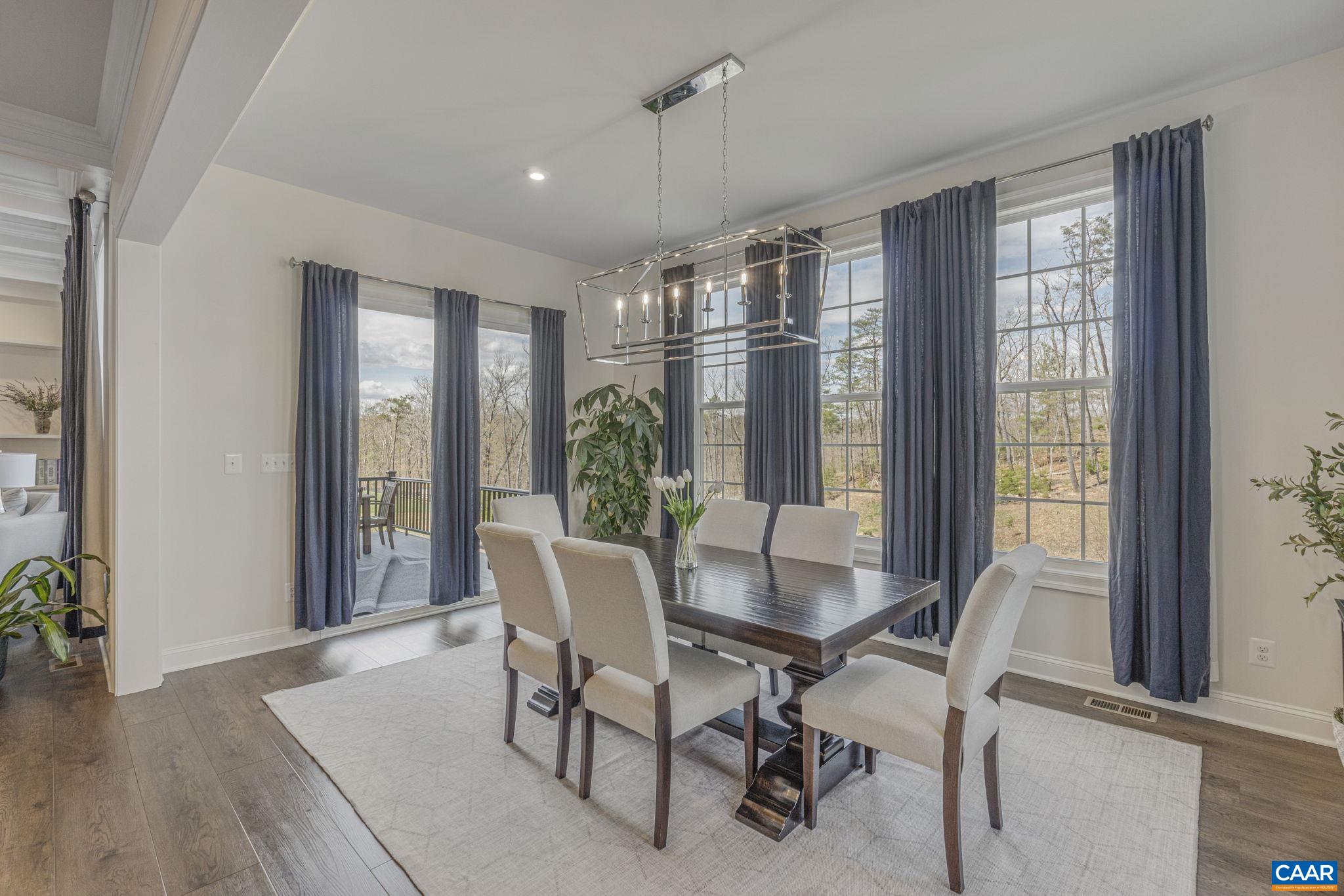 3624 Osprey Drive Keswick, VA 22947 - Photo 19 of 68 a view of a dining room with furniture window and wooden floor