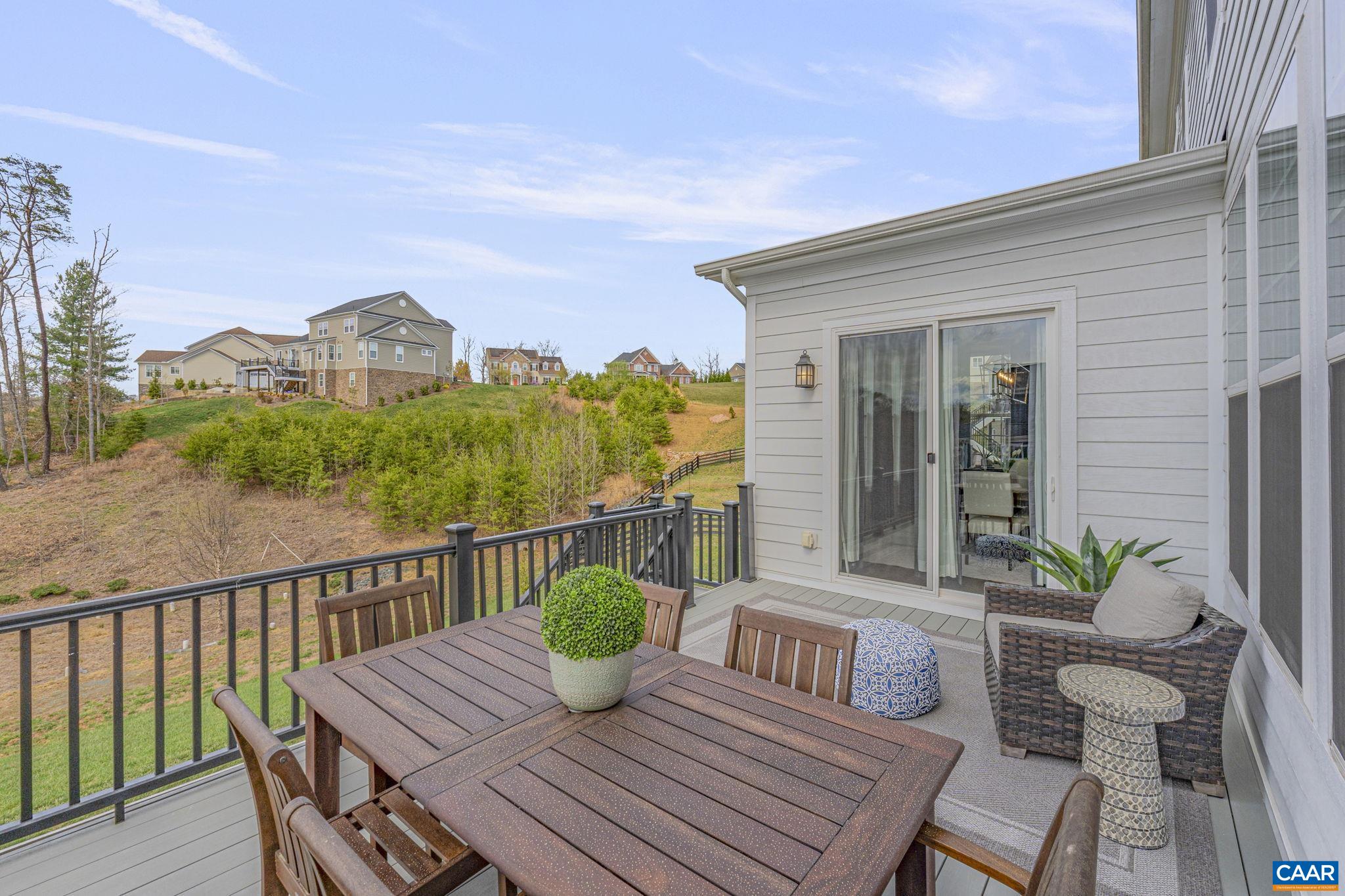 3624 Osprey Drive Keswick, VA 22947 - Photo 22 of 68 a view of a deck with furniture and a potted plant