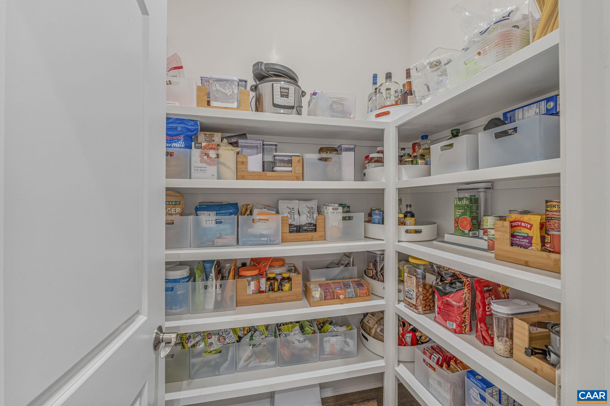 3624 Osprey Drive Keswick, VA 22947 - Photo 26 of 68 a shelf with books and knick knacks on it