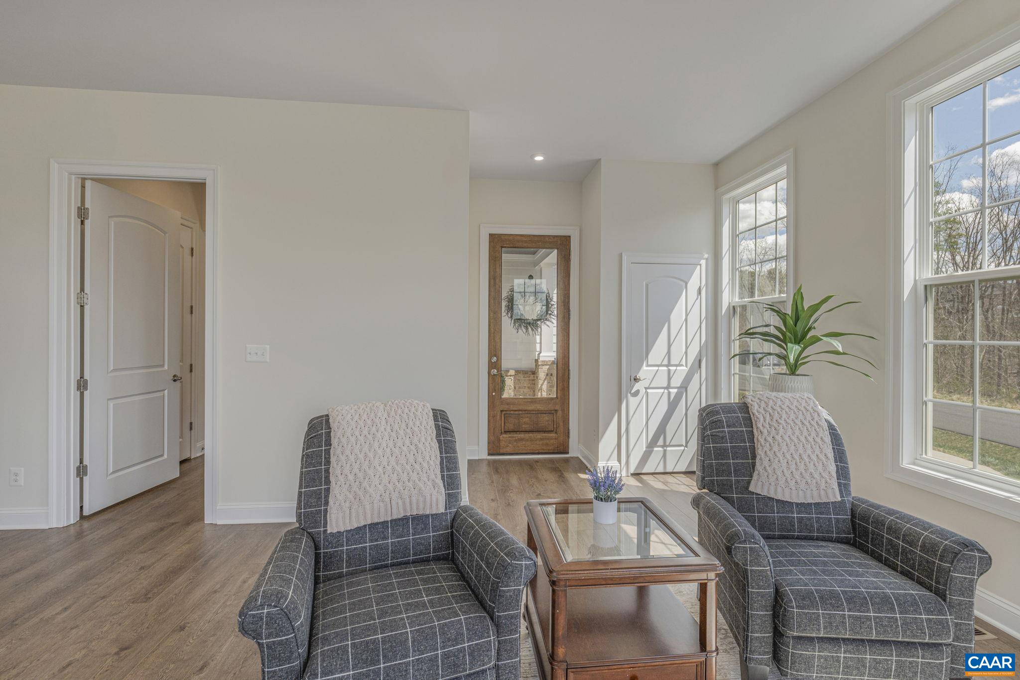 3624 Osprey Drive Keswick, VA 22947 - Photo 28 of 68 a living room with furniture and a potted plant