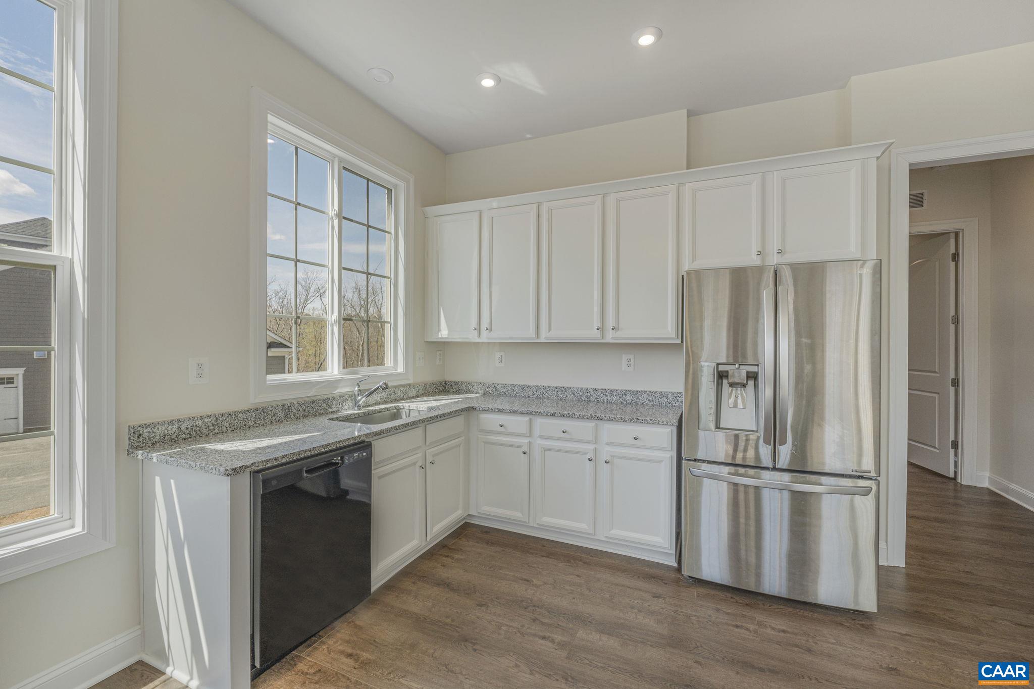 3624 Osprey Drive Keswick, VA 22947 - Photo 30 of 68 a kitchen with stainless steel appliances granite countertop a stove a refrigerator and a sink