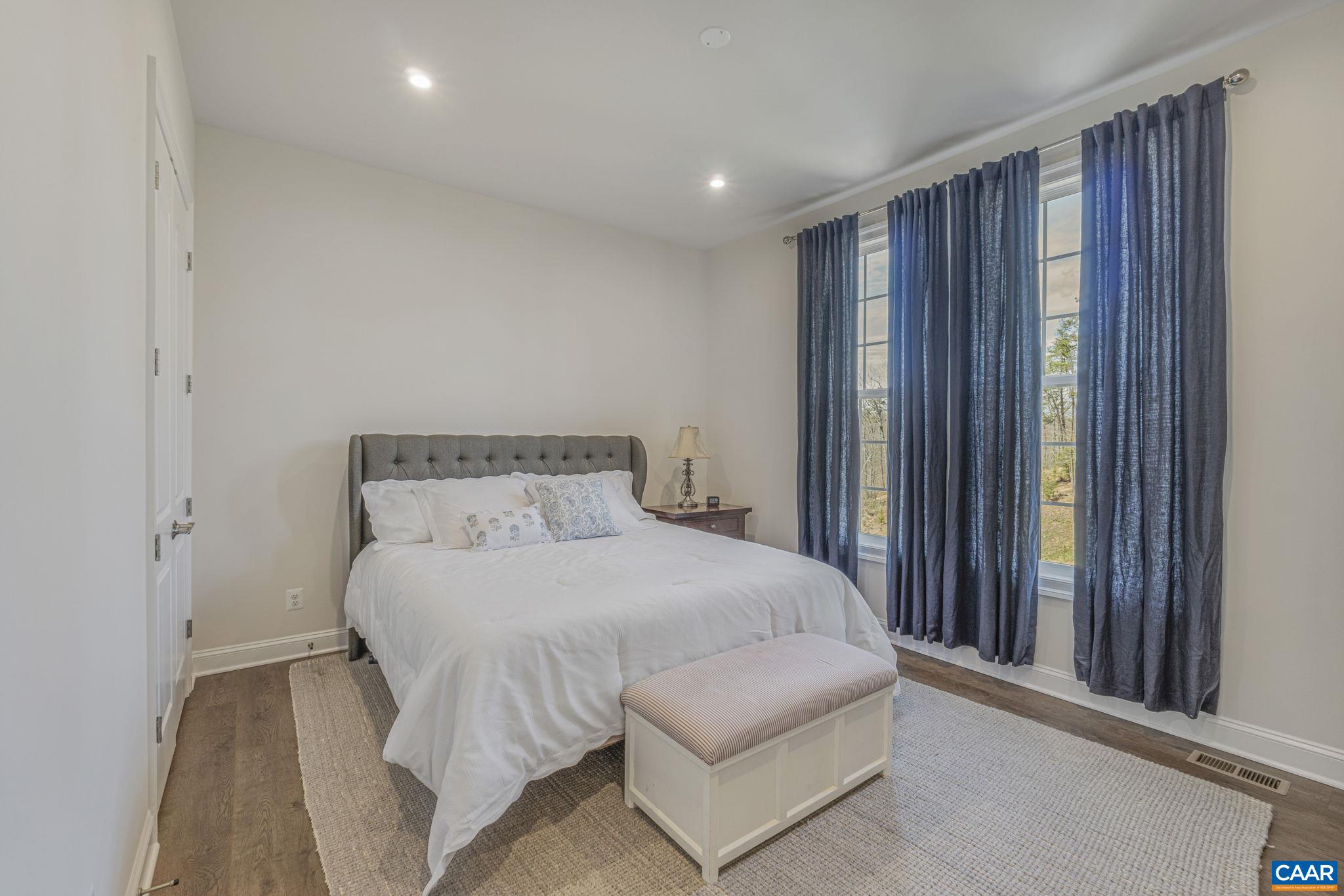 3624 Osprey Drive Keswick, VA 22947 - Photo 31 of 68 a bedroom with a bed and a window