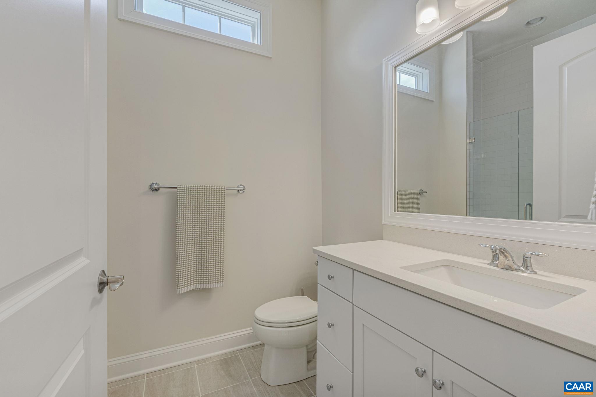 3624 Osprey Drive Keswick, VA 22947 - Photo 32 of 68 a bathroom with a sink toilet vanity and shower