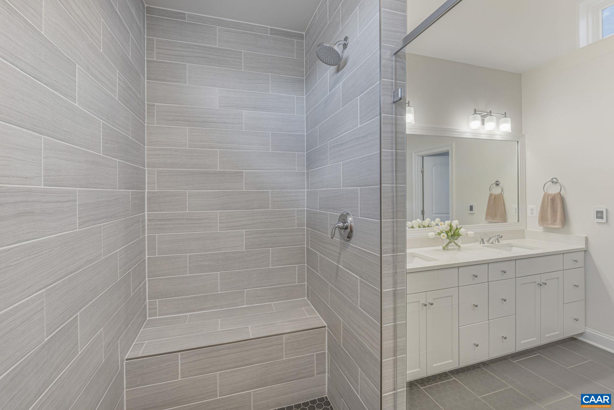 3624 Osprey Drive Keswick, VA 22947 - Photo 41 of 68 a bathroom with a double vanity sink and mirror
