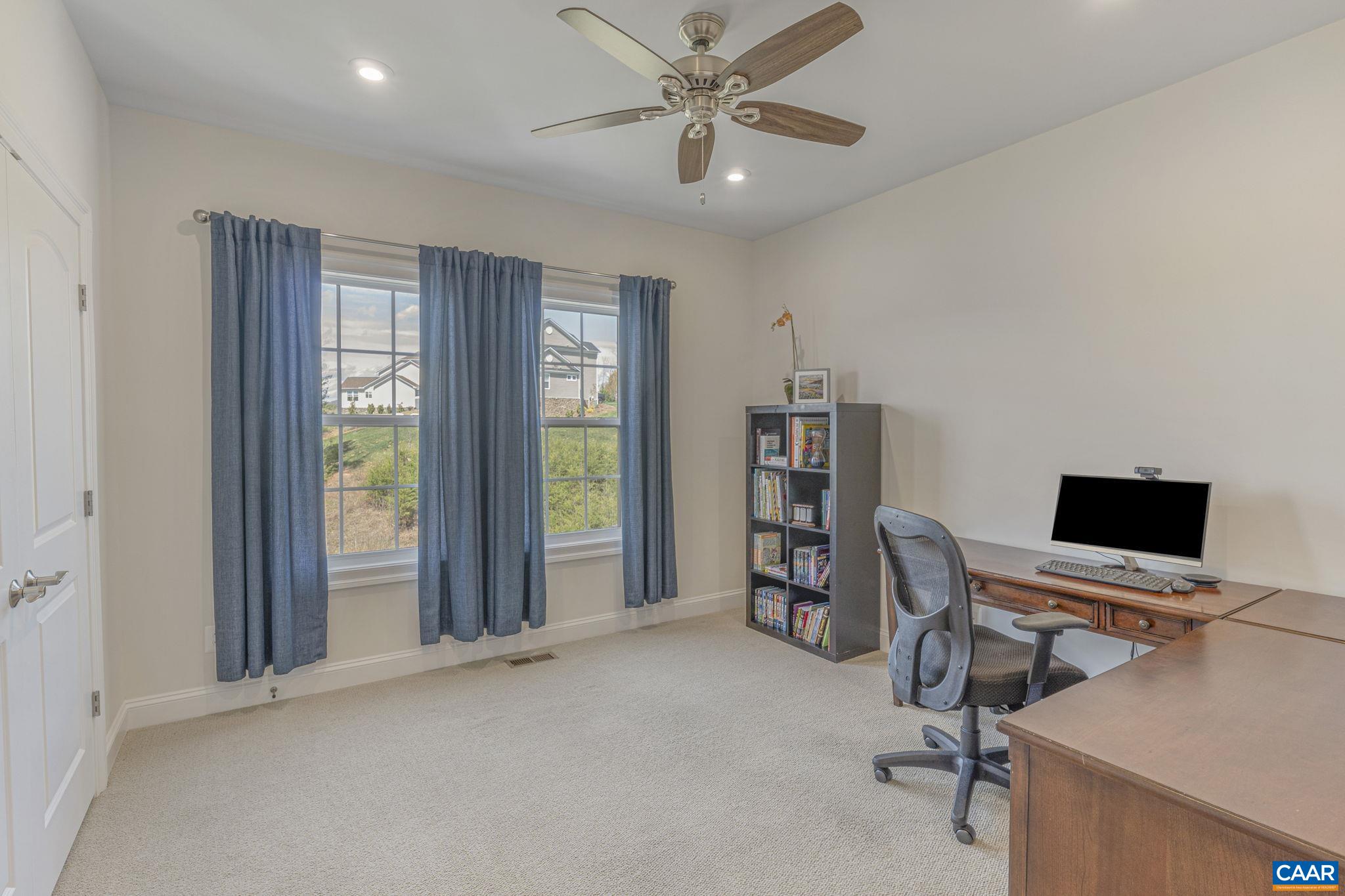 3624 Osprey Drive Keswick, VA 22947 - Photo 49 of 68 a view of a workspace with furniture and a window