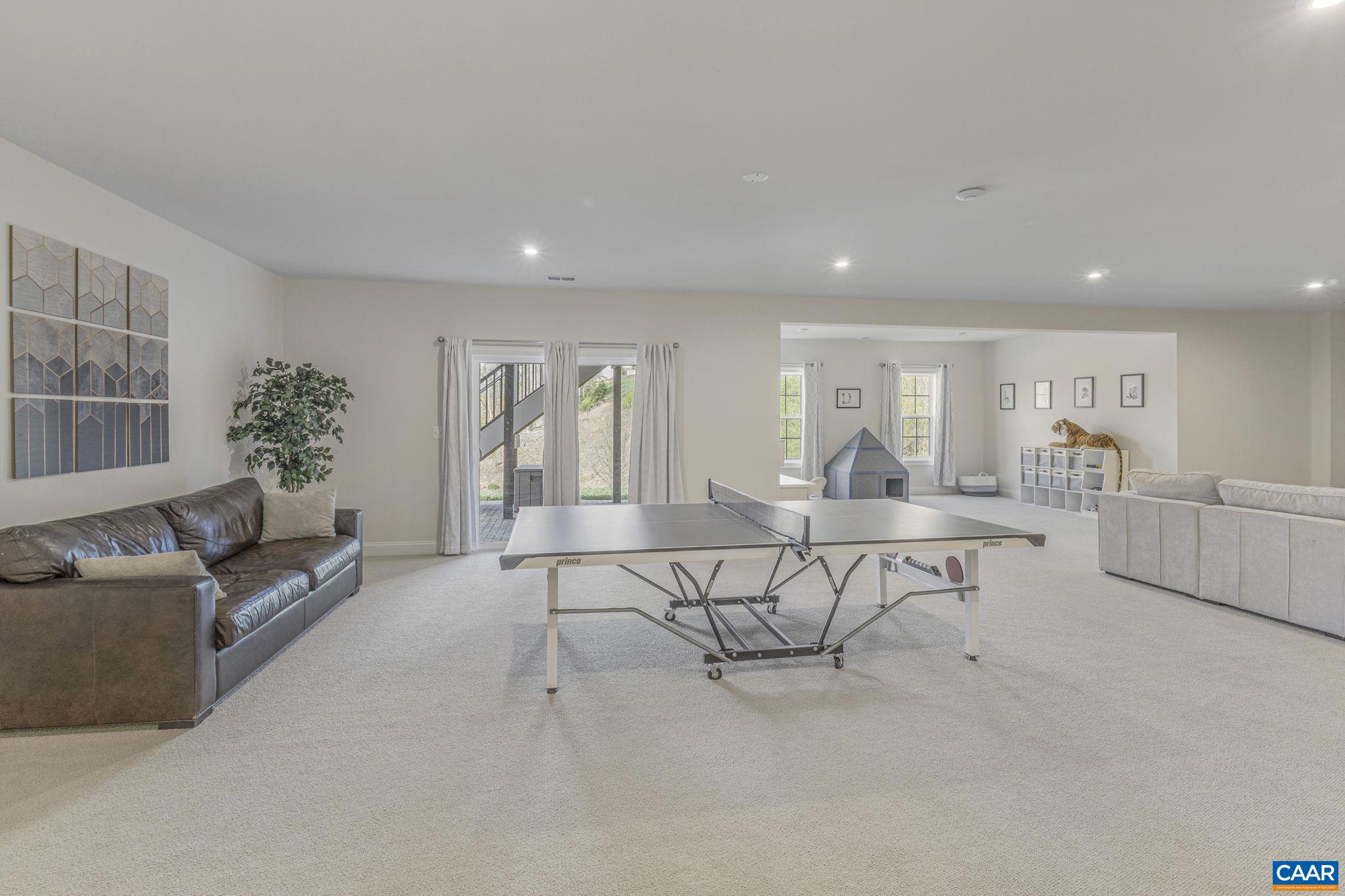 3624 Osprey Drive Keswick, VA 22947 - Photo 51 of 68 a living room with furniture and a table
