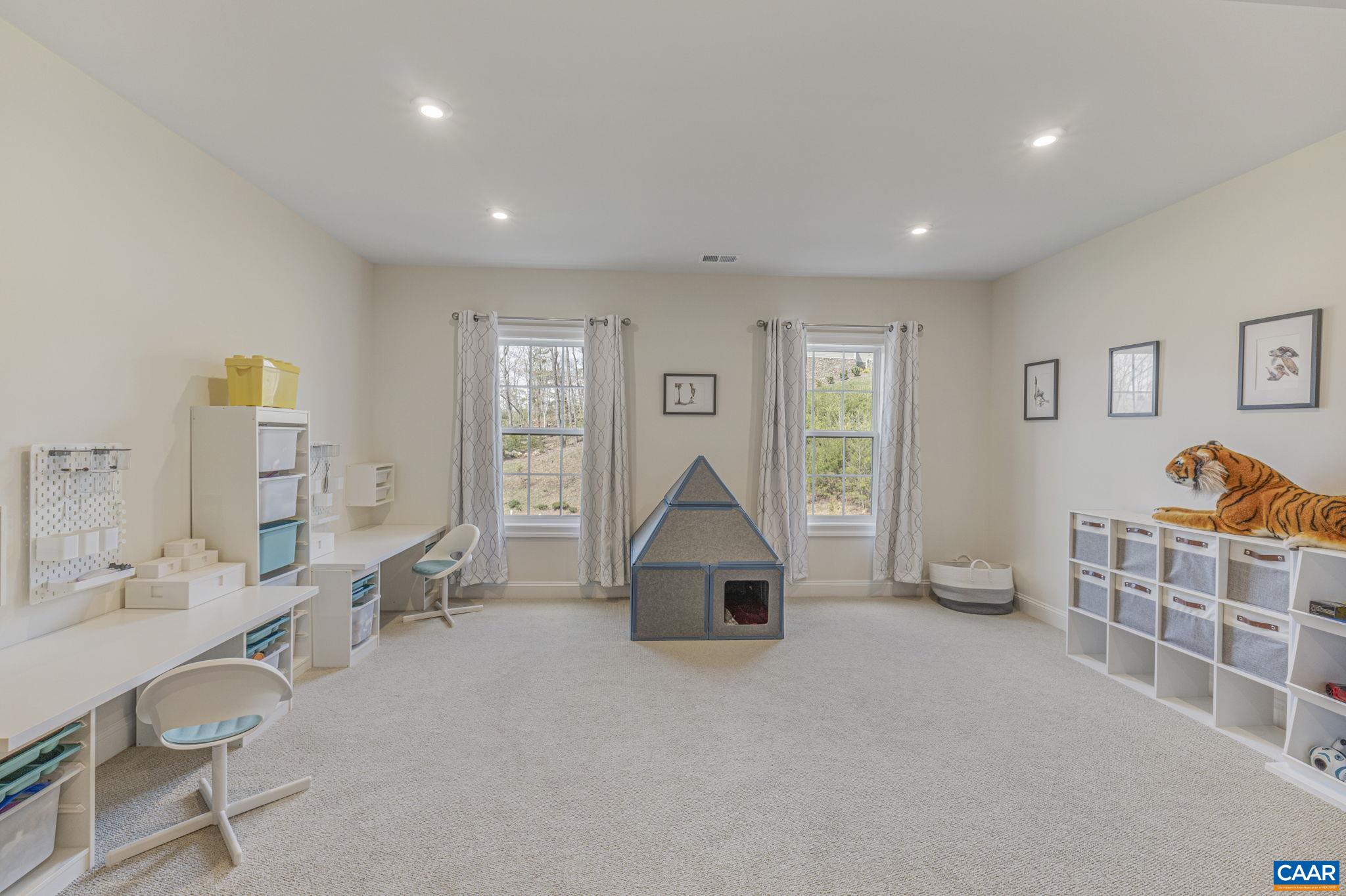 3624 Osprey Drive Keswick, VA 22947 - Photo 52 of 68 a living room with furniture a window and gym equipment