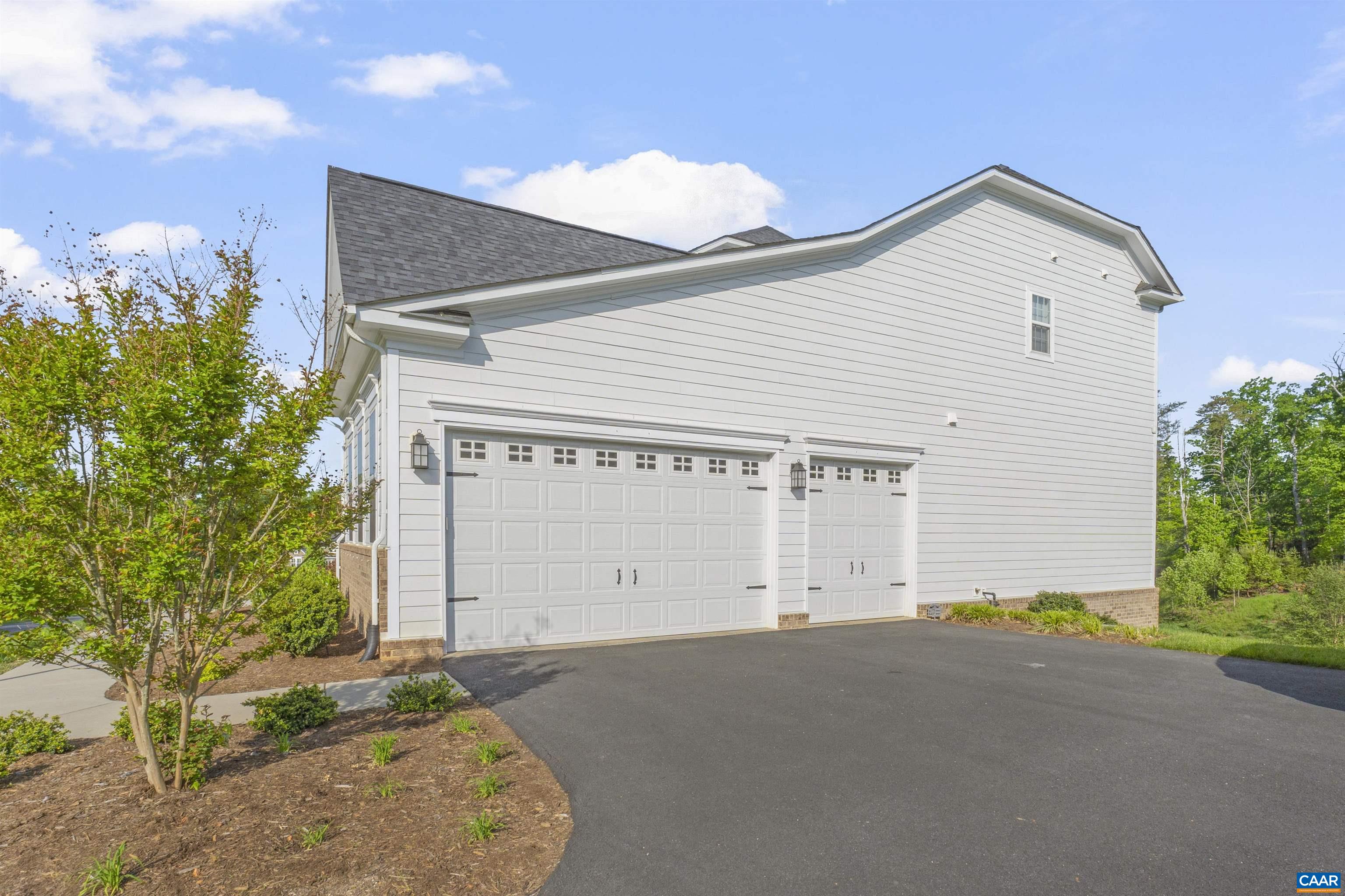 3624 Osprey Drive Keswick, VA 22947 - Photo 63 of 68 a front view of a house with a garage