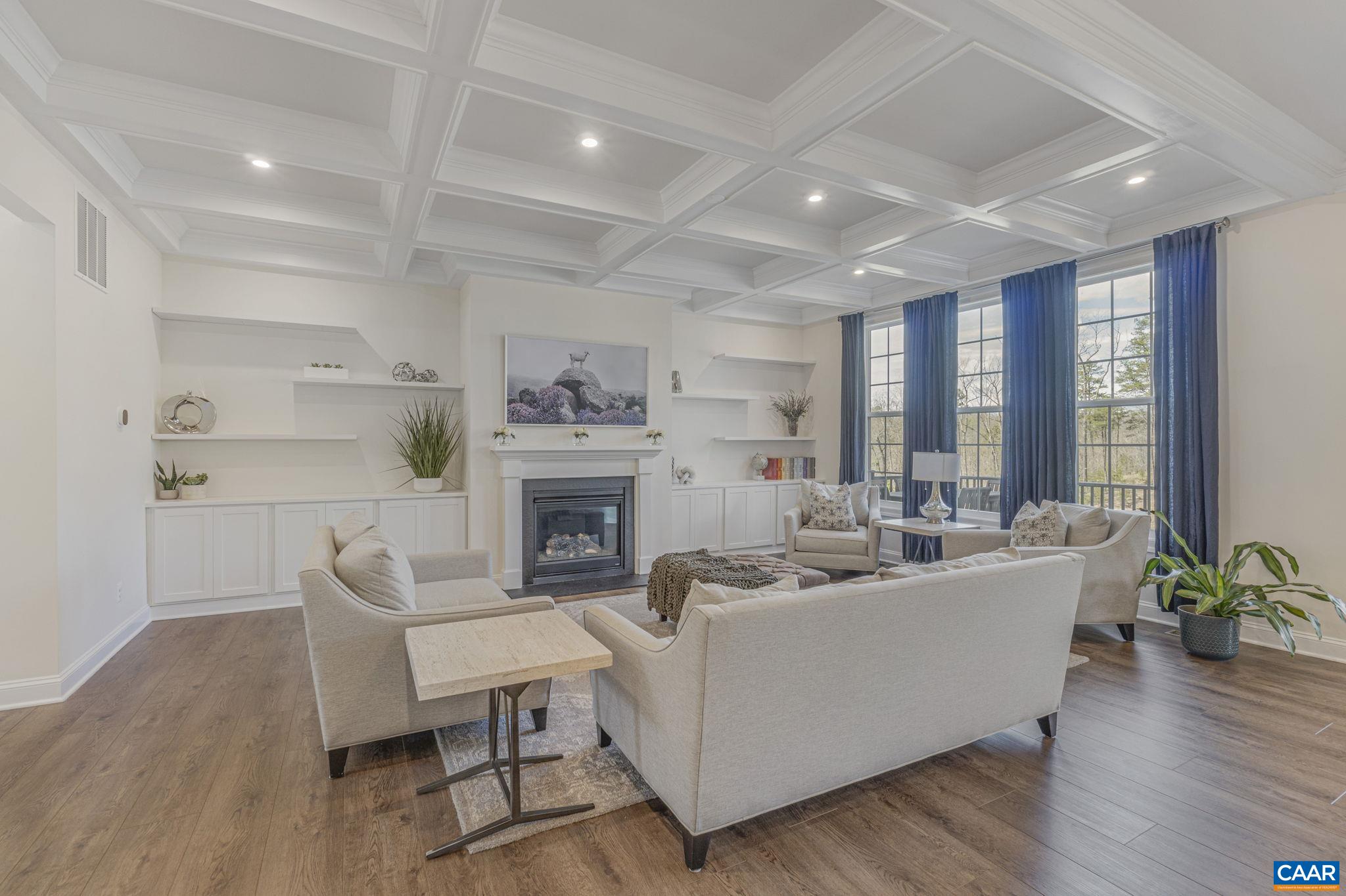 3624 Osprey Drive Keswick, VA 22947 - Photo 7 of 68 a living room with furniture a fireplace and a potted plant