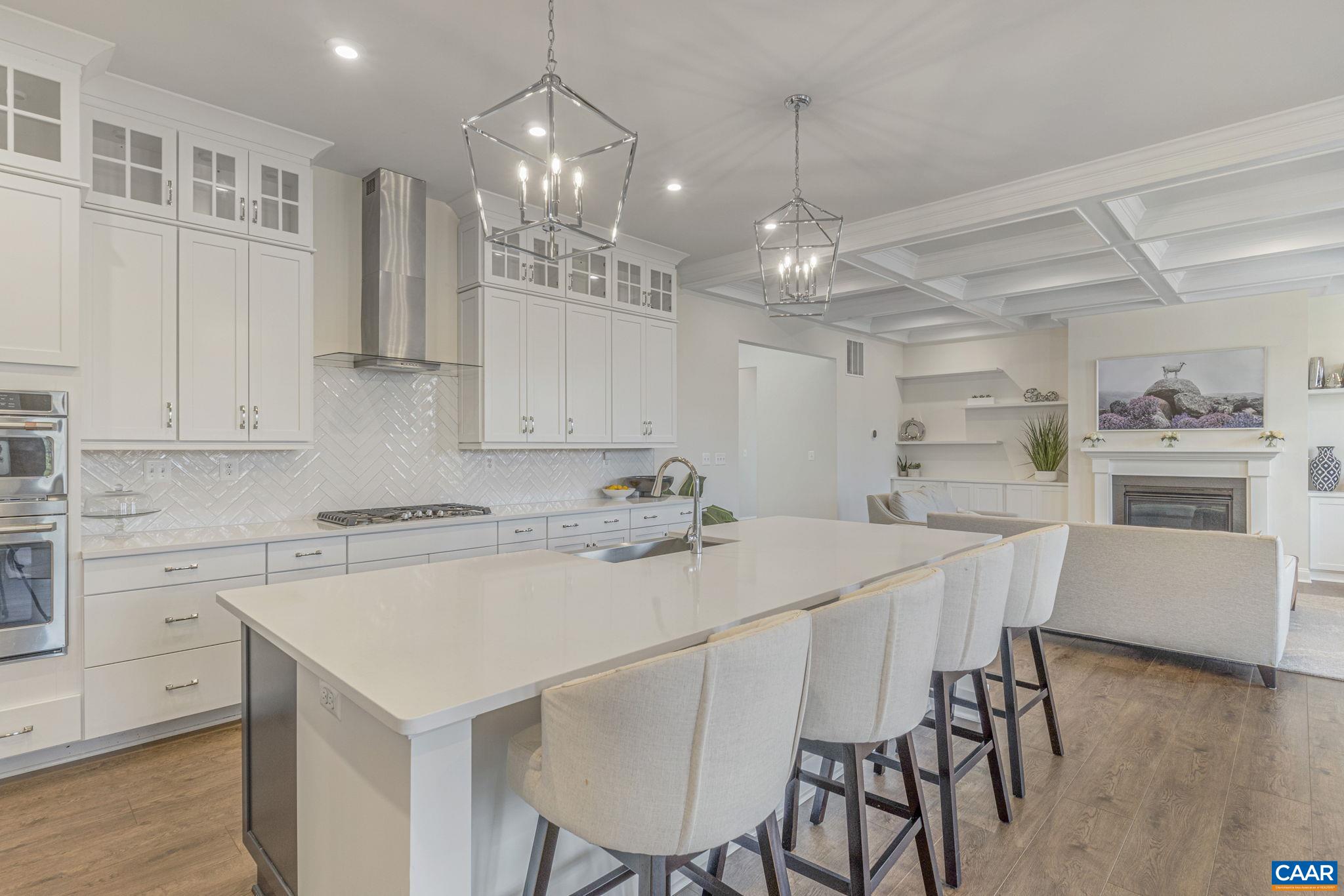 3624 Osprey Drive Keswick, VA 22947 - Photo 10 of 68 a kitchen with a dining table chairs stainless steel appliances and cabinets