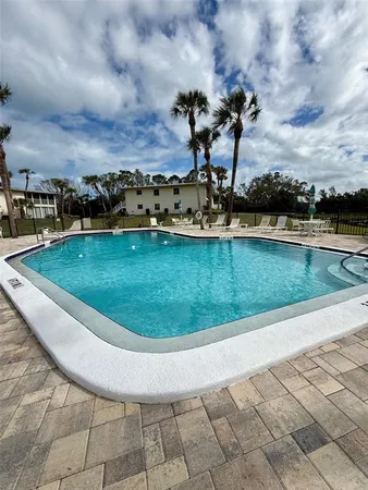 a kitchen with a sink appliances and cabinets