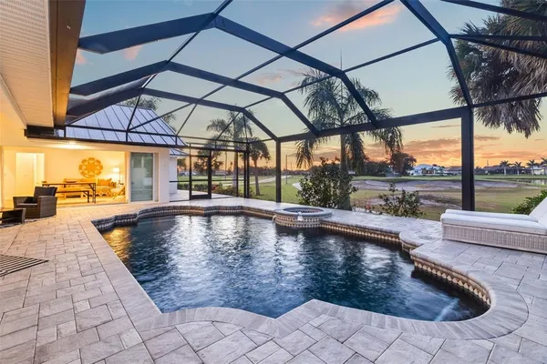 a view of swimming pool with a patio