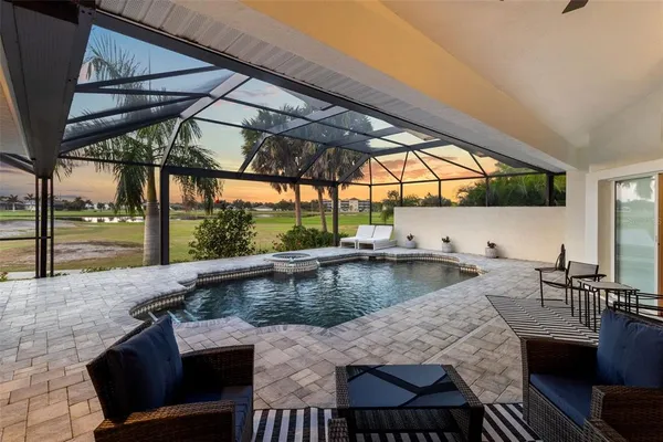 a view of a swimming pool with a lounge chairs
