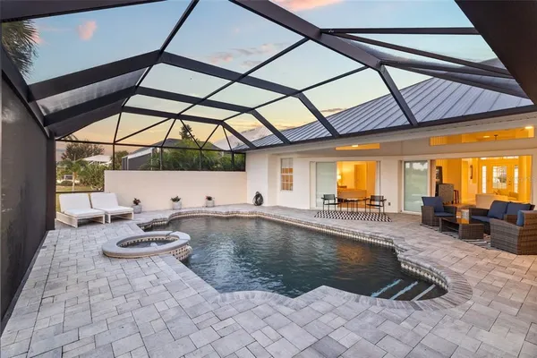 an aerial view of a house with a swimming pool
