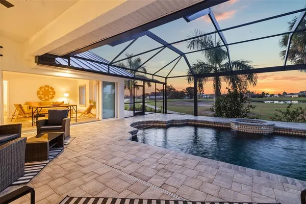 a view of a swimming pool with a table and chairs