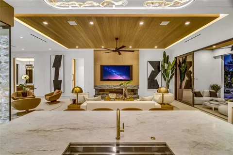a bathroom with a double vanity sink a mirror and a bathtub