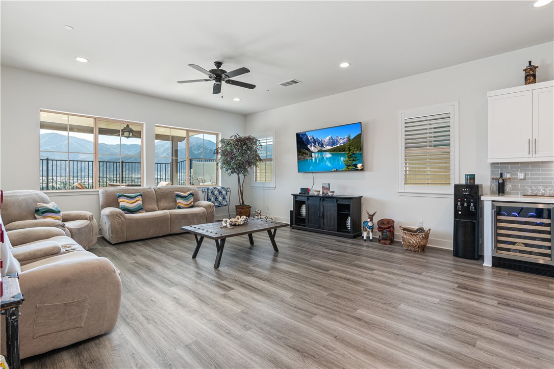 11523 Explorer Court Corona, CA 92883 - Photo 11 of 64 a living room with furniture and wooden floor