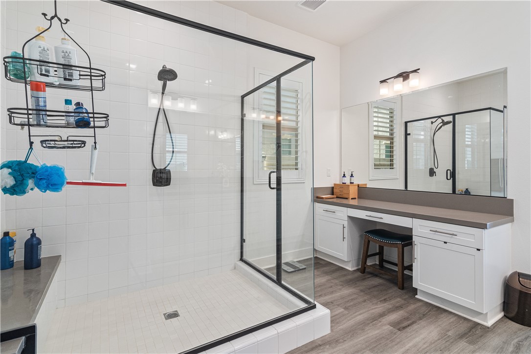 11523 Explorer Court Corona, CA 92883 - Photo 18 of 64 a bathroom with a tub sink and mirror