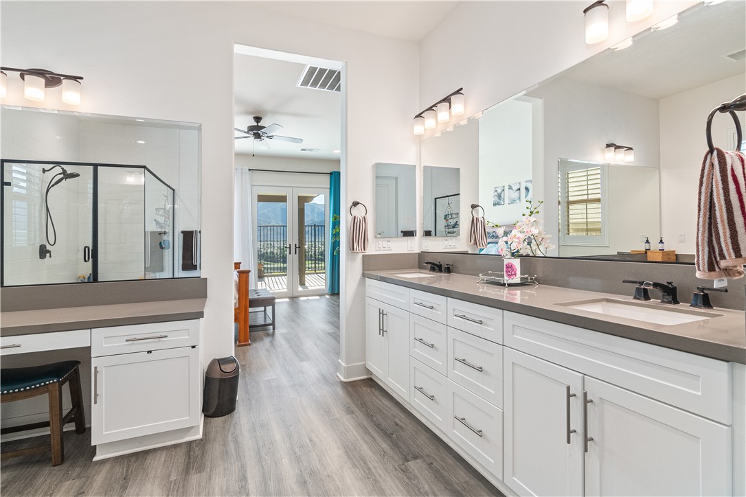 11523 Explorer Court Corona, CA 92883 - Photo 19 of 64 a spacious en suite bathroom with double sink and a large mirror