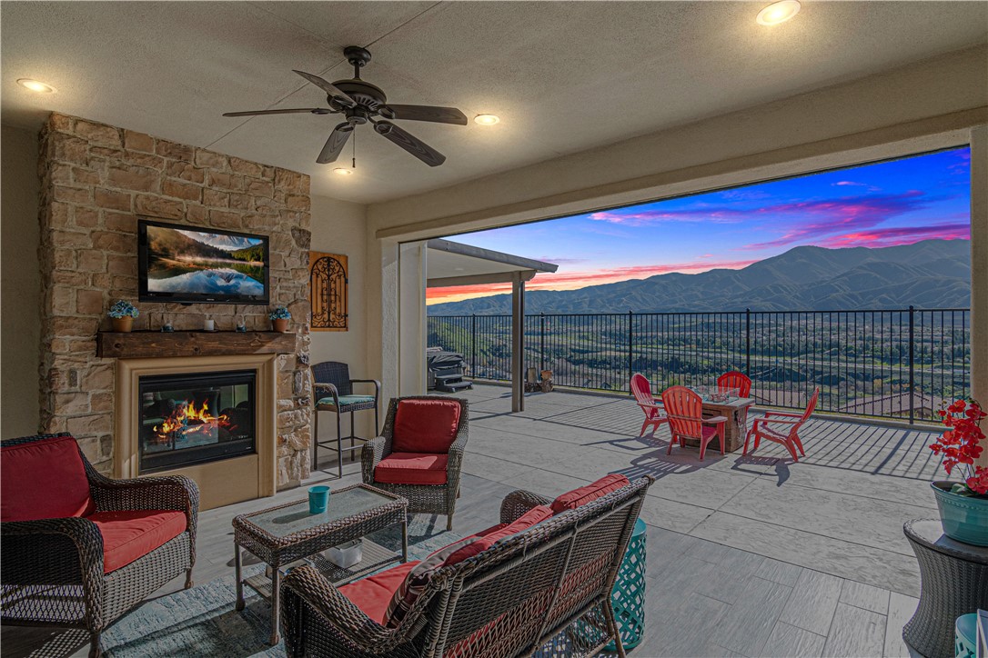 11523 Explorer Court Corona, CA 92883 - Photo 38 of 64 a living room with furniture a fireplace and a flat screen tv