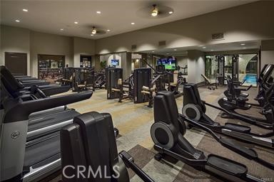 11523 Explorer Court Corona, CA 92883 - Photo 55 of 64 a room with gym equipment and a large window