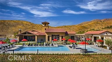 11523 Explorer Court Corona, CA 92883 - Photo 62 of 64 a group of people sitting in front of retail shops