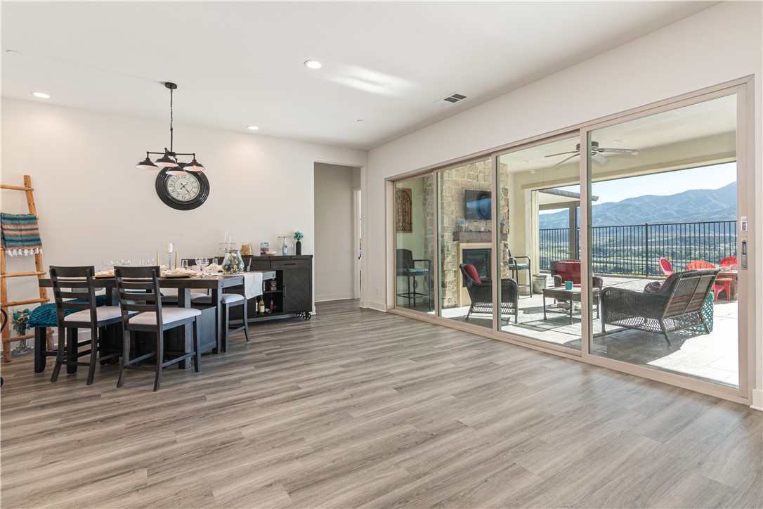 11523 Explorer Court Corona, CA 92883 - Photo 9 of 64 a view of a dining room with furniture window and wooden floor