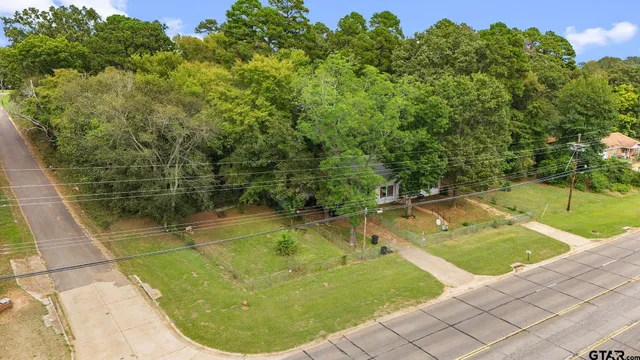 a view of a swimming pool with a yard
