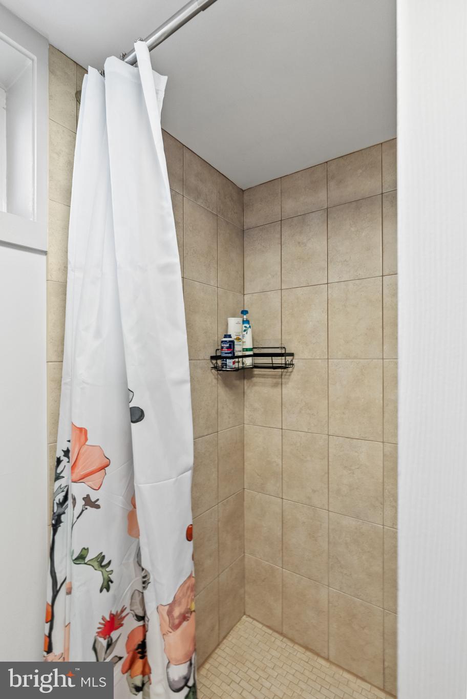819 Chillum Road Hyattsville, MD 20783 - Photo 23 of 48 a bathroom with a shower and a sink
