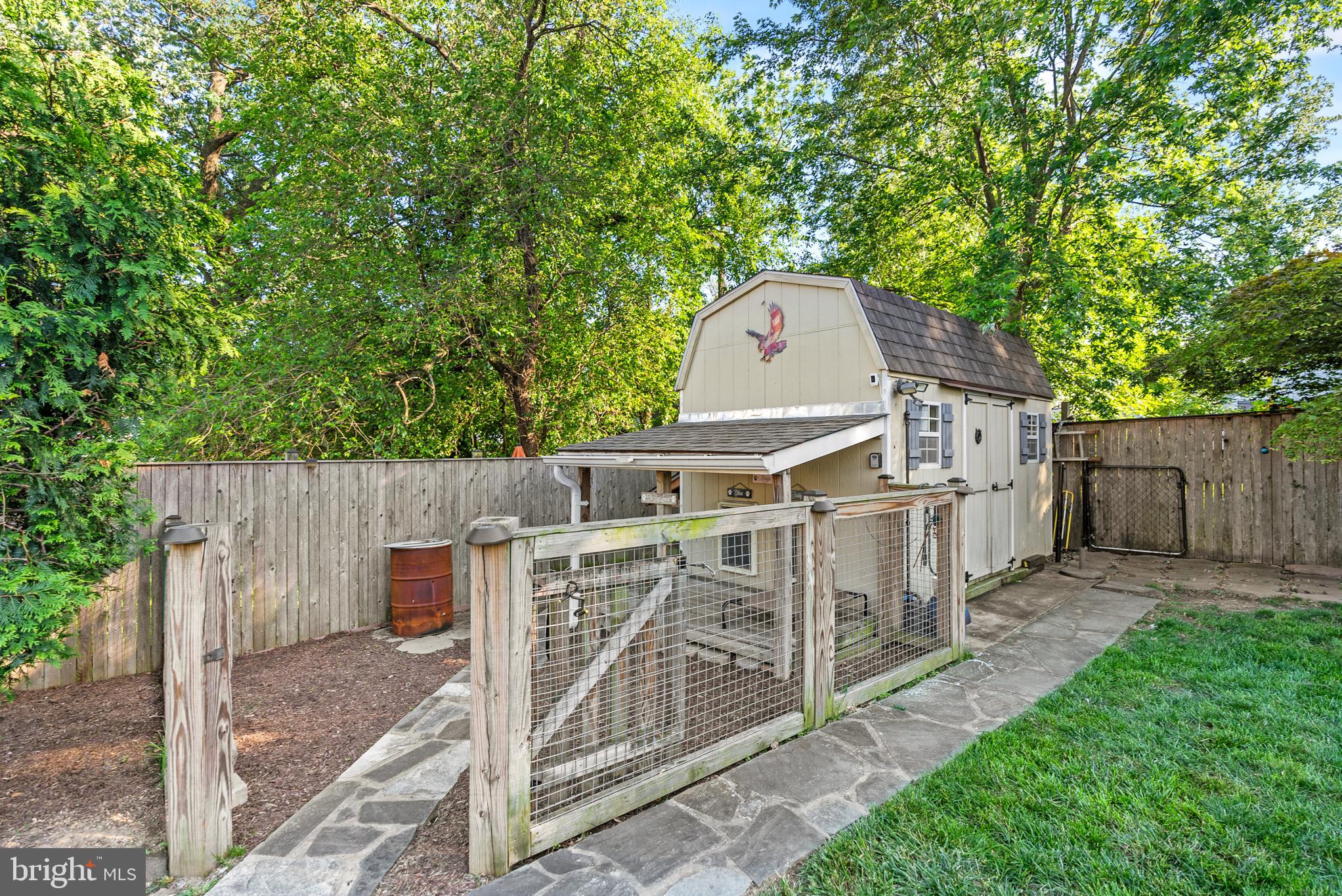 819 Chillum Road Hyattsville, MD 20783 - Photo 43 of 48 a view of a wooden fence with a tree in the yard
