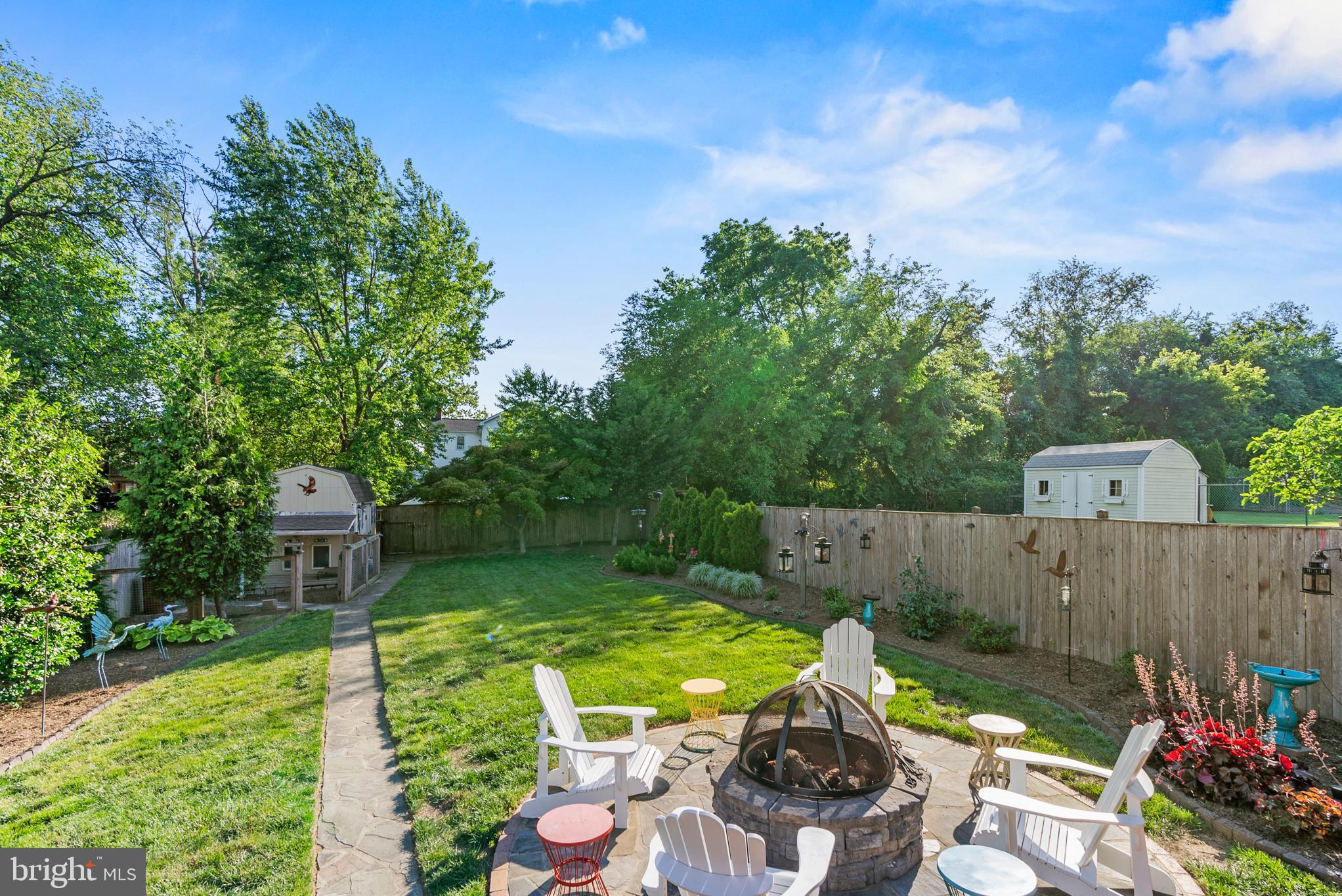 819 Chillum Road Hyattsville, MD 20783 - Photo 44 of 48 a view of a backyard with chair and fire pit