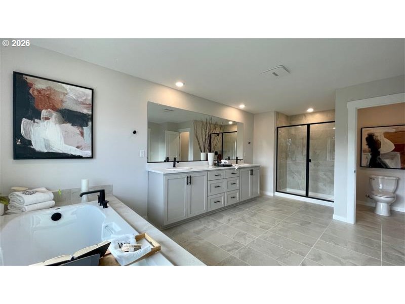 16786 Southwest Leaf Lane Portland, OR 97224 - Photo 8 of 39 a upper view of a living room a bathroom with a sink and mirror
