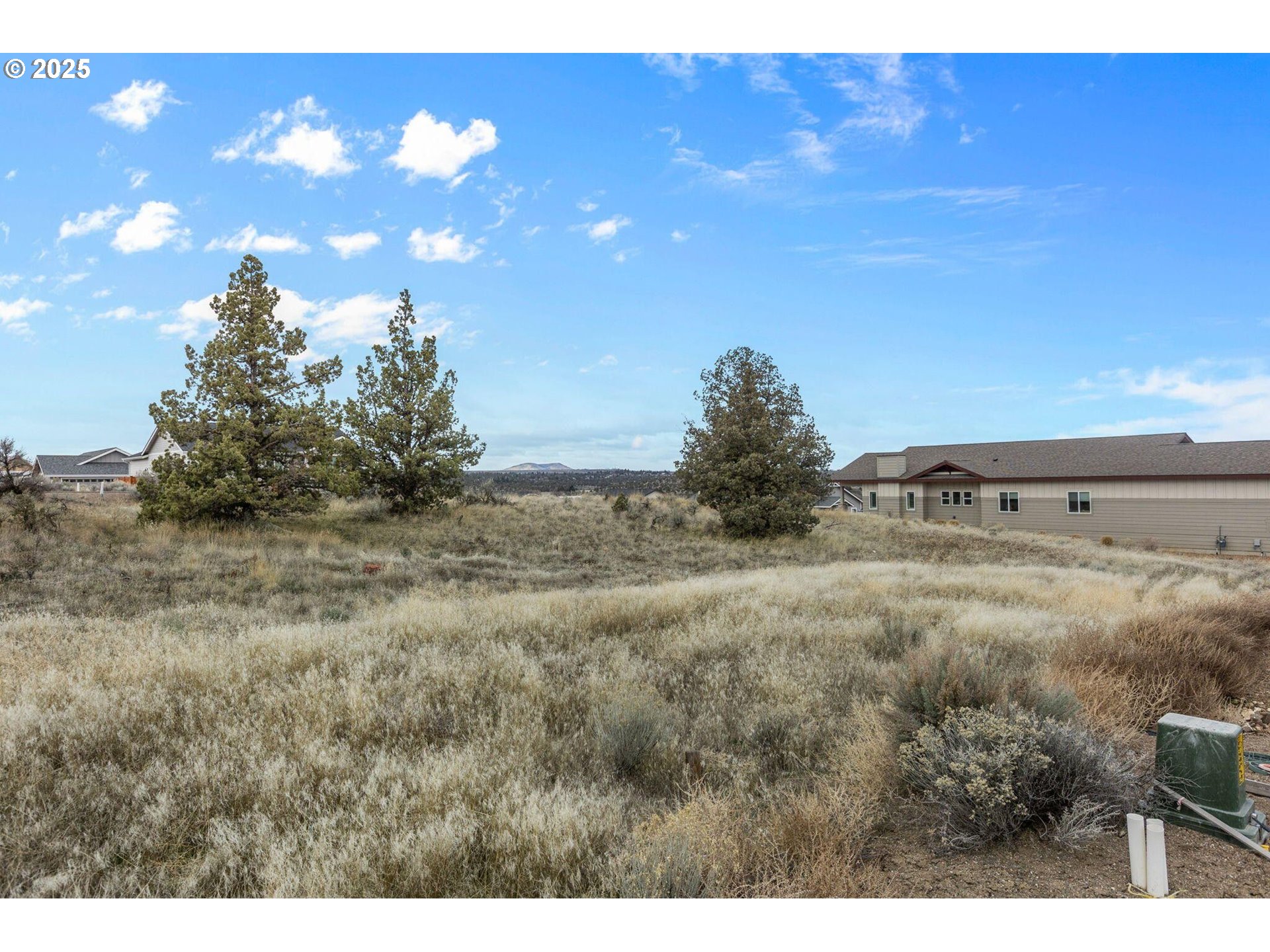 Southeast Greenleaf Lane Madras, OR 97741 - Photo 10 of 12 a view of a large yard with lots of green space