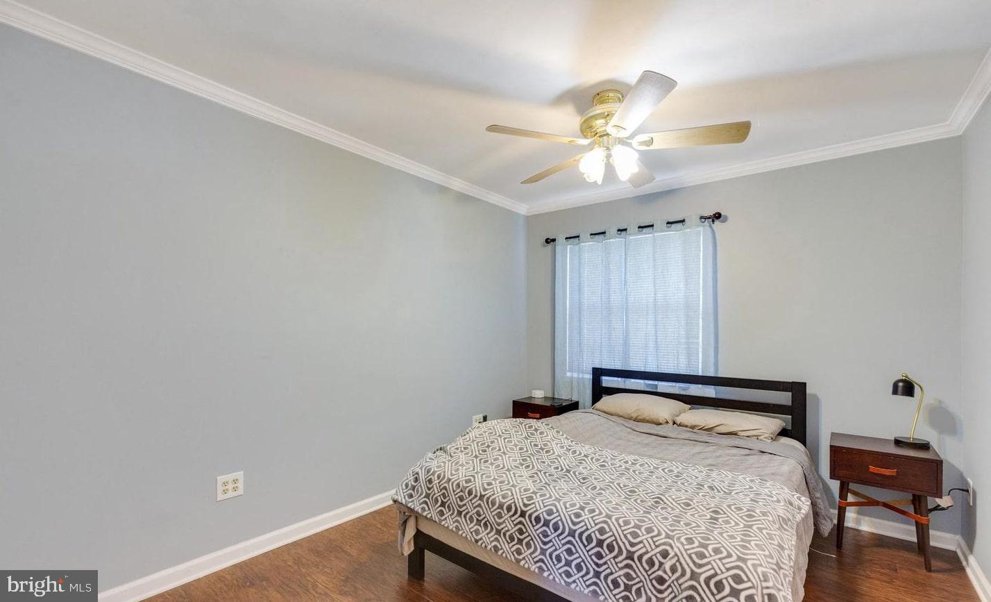6226 Apache Street Springfield, VA 22150 - Photo 10 of 15 Serene bedroom with soft lighting.
