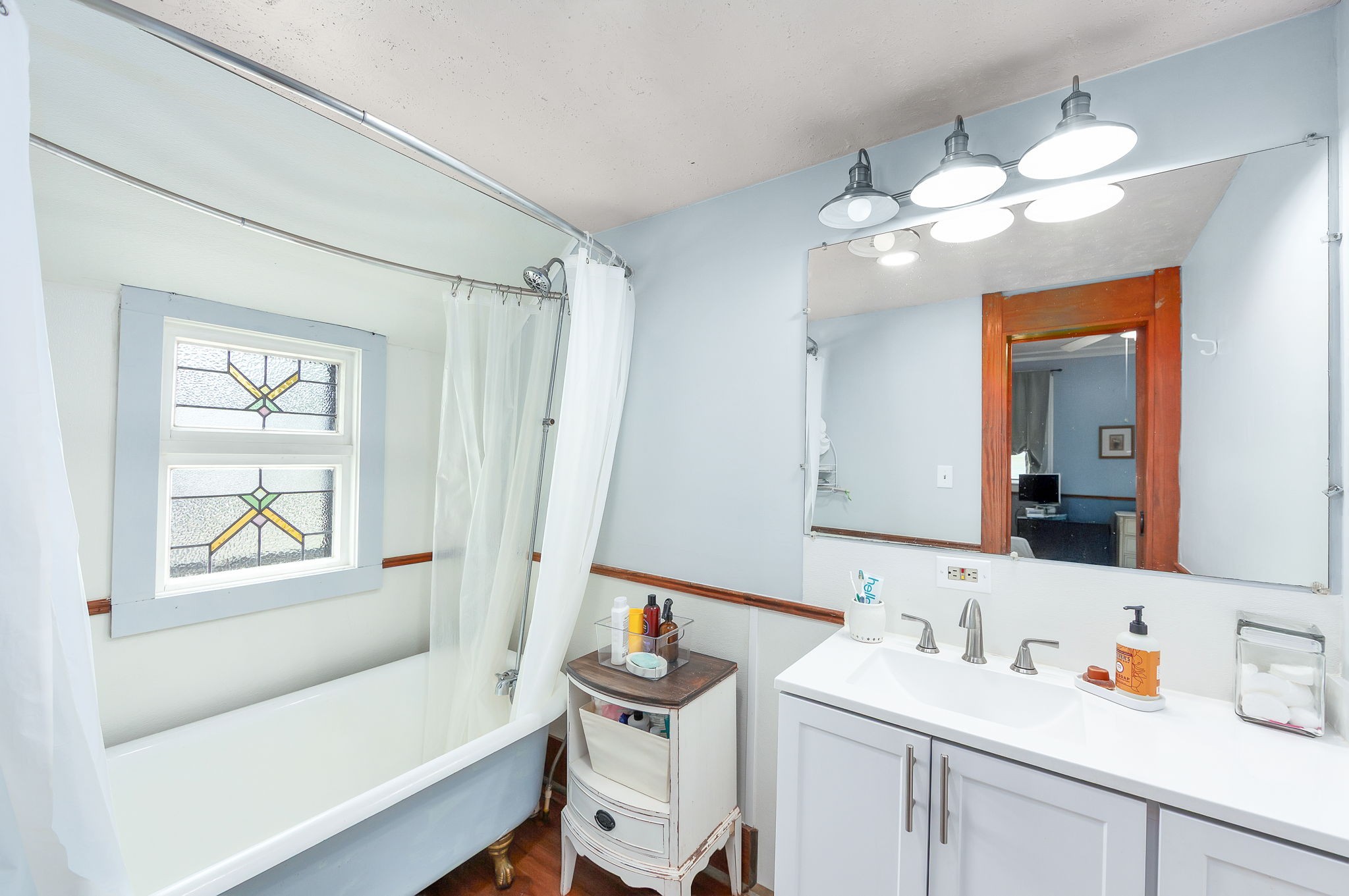 890 Fitts-Ross Road Bolivar, TN 38008 - Photo 10 of 53 a bathroom with a sink a tub and a mirror