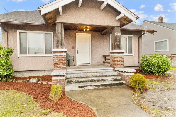 a front view of a house with a outdoor seating