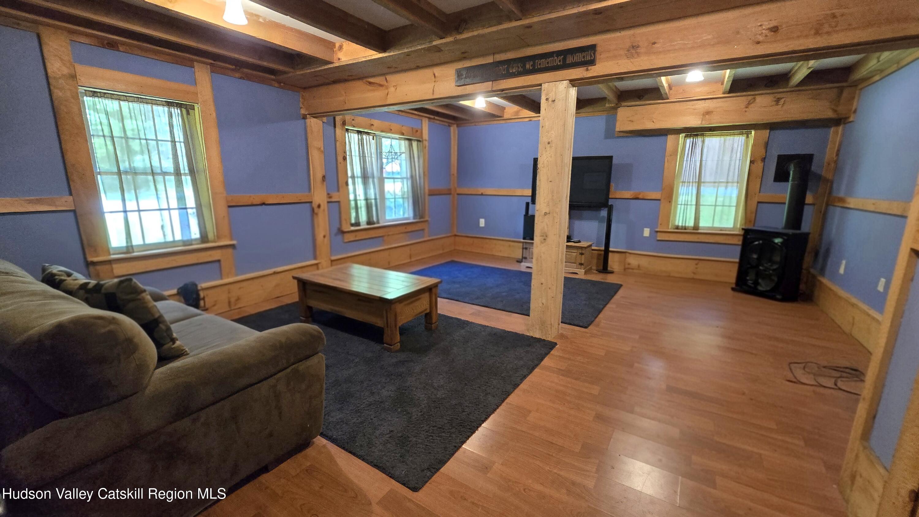 3620 County Rte 9 East Chatham, NY 12060 - Photo 20 of 28 a living room with furniture bathtub and a window