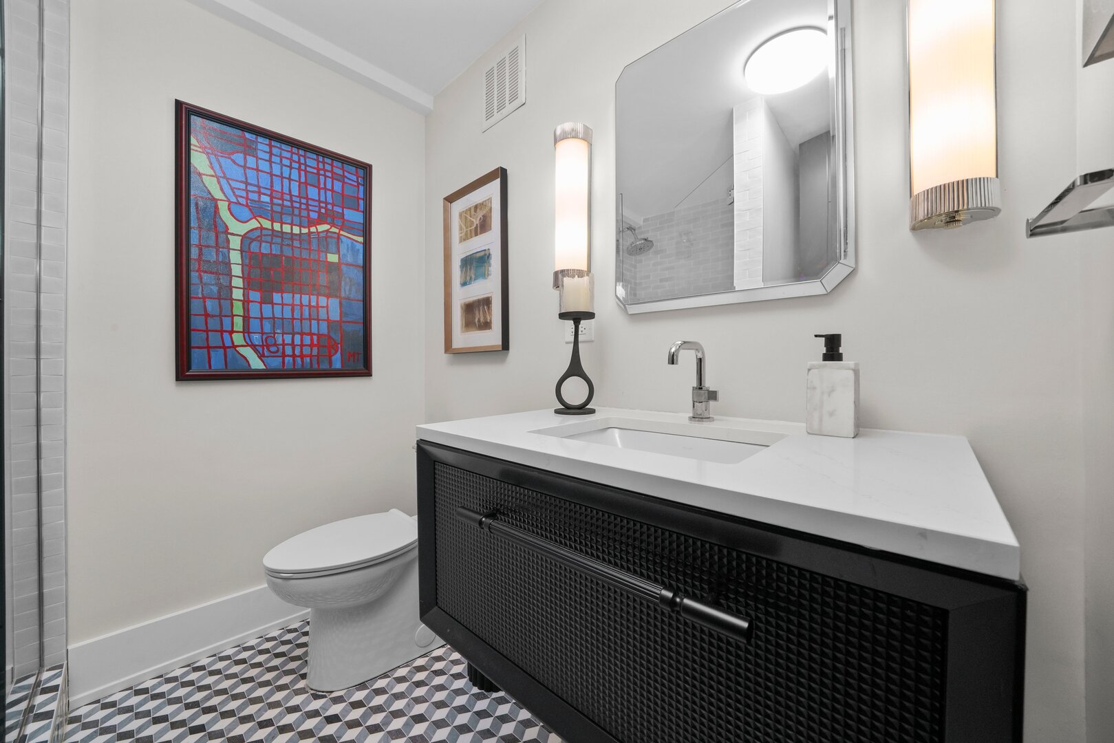1630 Sheridan Road, Unit 2N Wilmette, IL 60091 - Photo 18 of 32 a bathroom with a sink a toilet and mirror