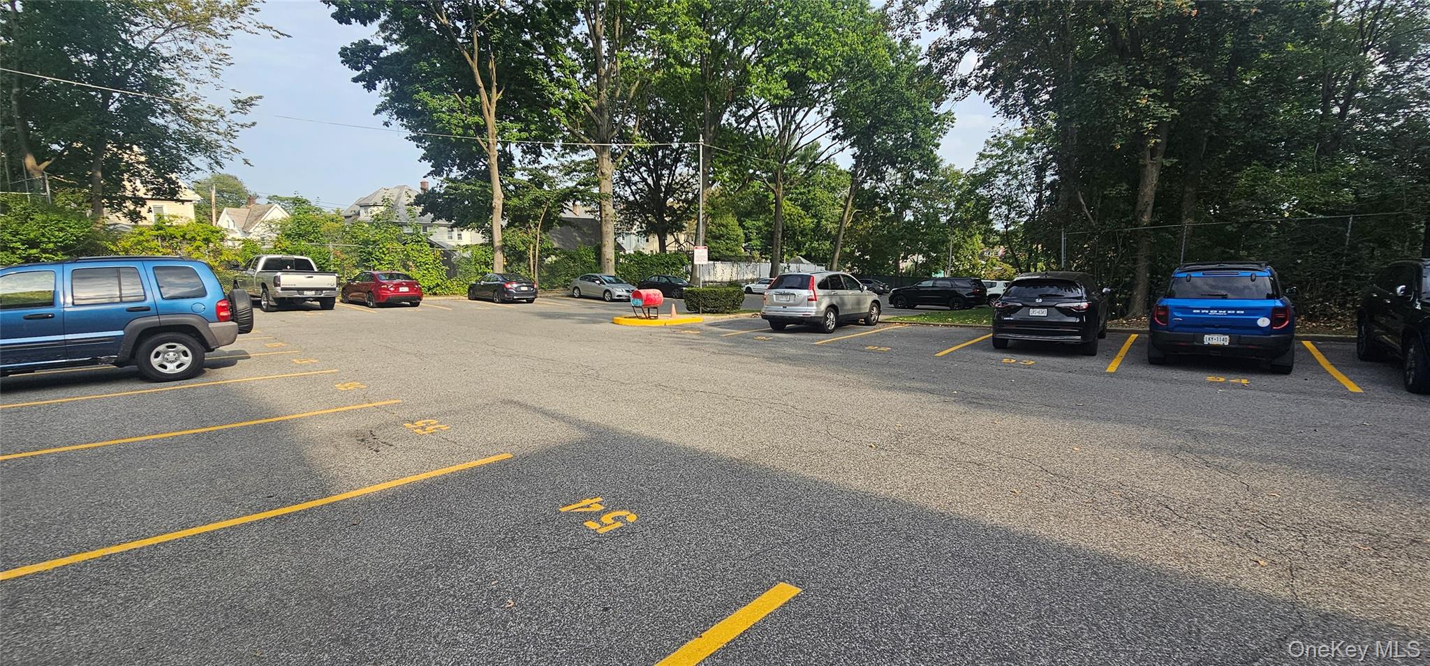 126 Church Street, Unit 2D New Rochelle, NY 10805 - Photo 13 of 15 View of uncovered parking lot