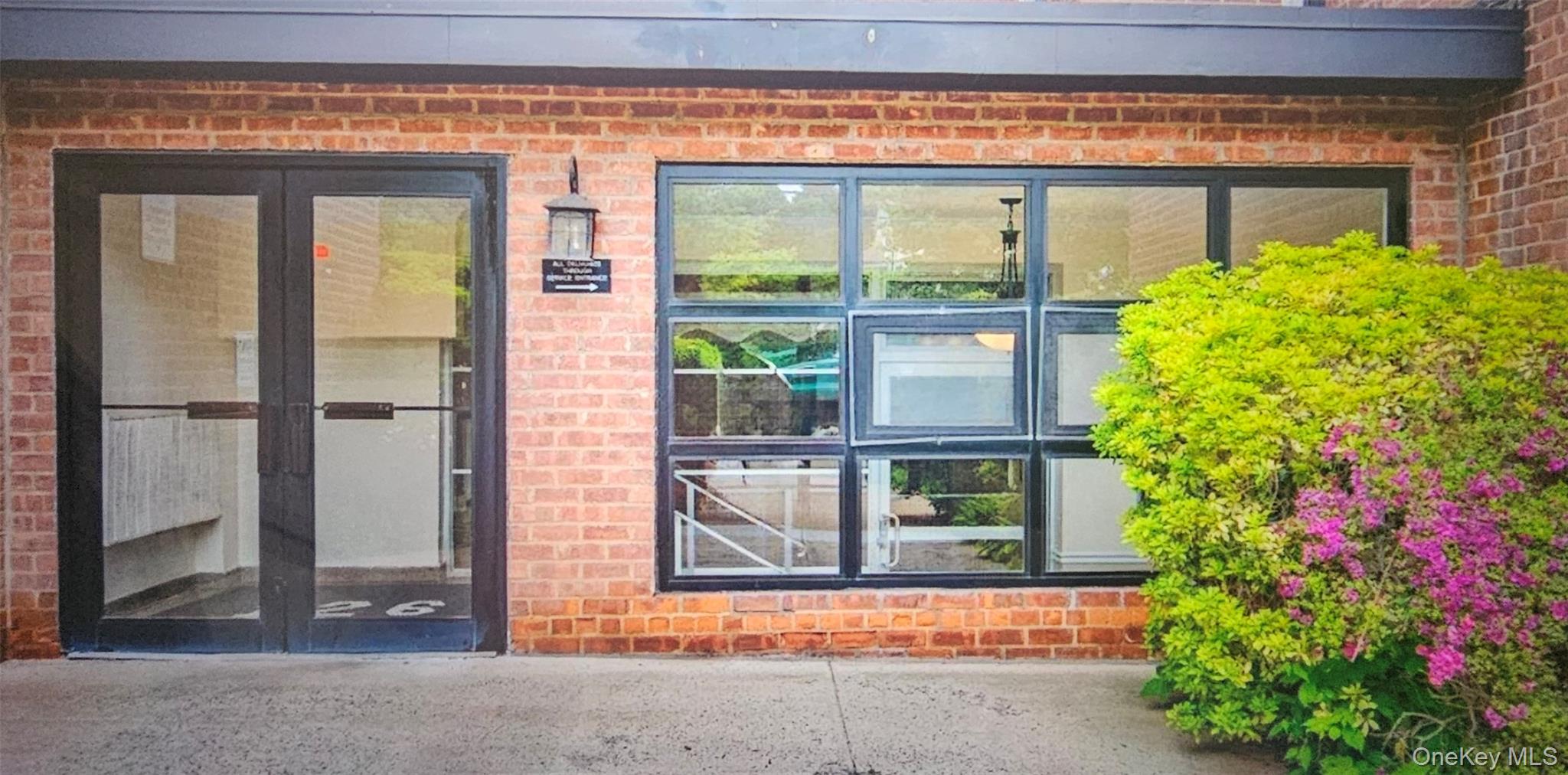 126 Church Street, Unit 2D New Rochelle, NY 10805 - Photo 2 of 15 Entrance to property with brick siding