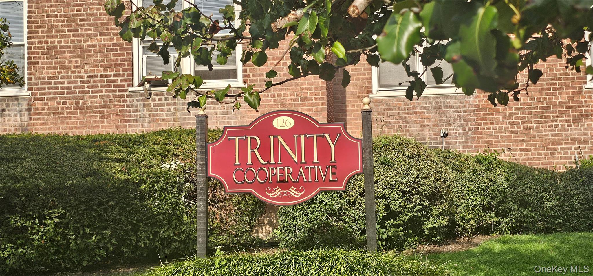 126 Church Street, Unit 2D New Rochelle, NY 10805 - Photo 30 of 32 a sign that is on a brick wall