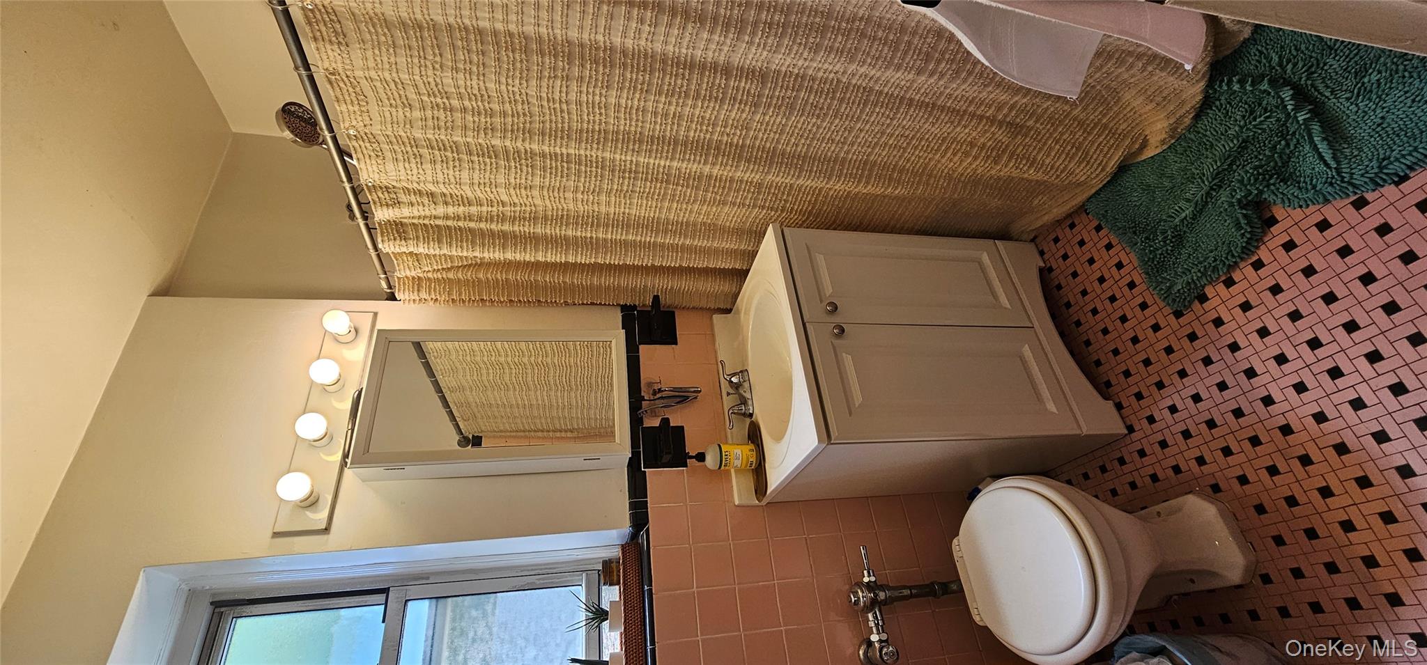 126 Church Street, Unit 2D New Rochelle, NY 10805 - Photo 7 of 15 Full bathroom with vanity, tile walls, a wainscoted wall, a shower with shower curtain, and tile patterned flooring