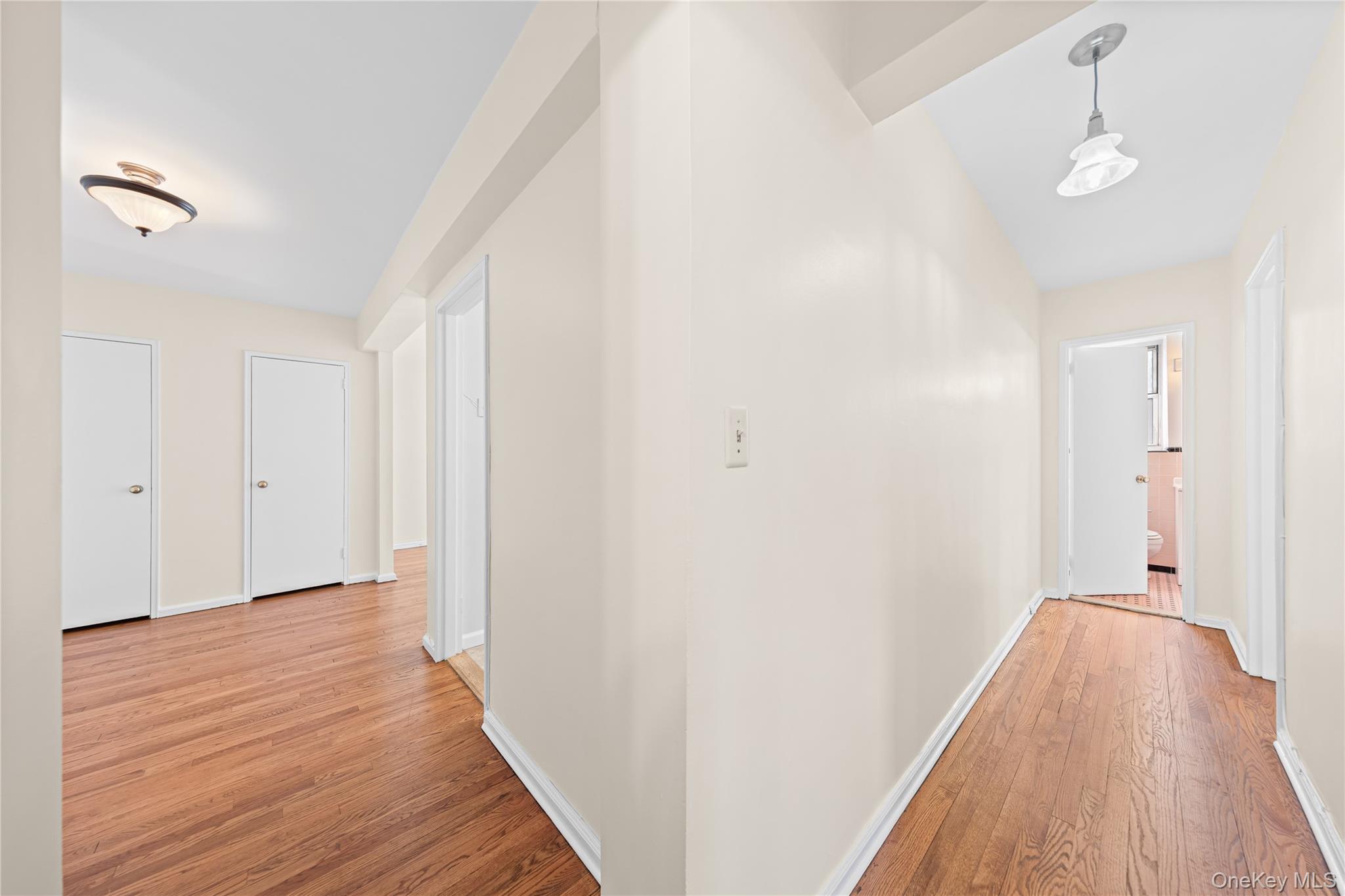 126 Church Street, Unit 2D New Rochelle, NY 10805 - Photo 7 of 32 a view of a room with wooden floor and bathroom