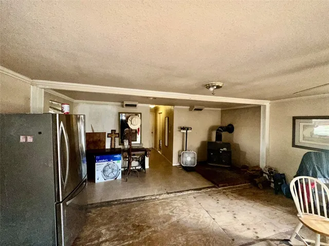 a view of a hallway with furniture and closet area