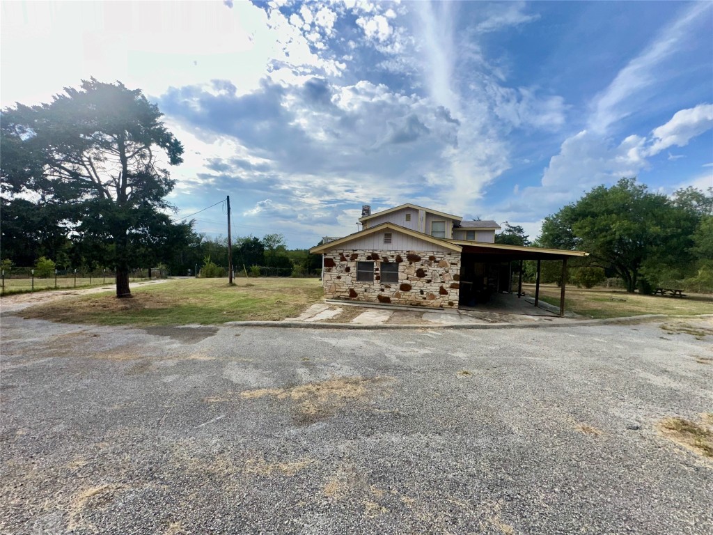 109 Wayside Drive Elgin, TX 78621 - Photo 19 of 31 a view of a tiny house with a yard