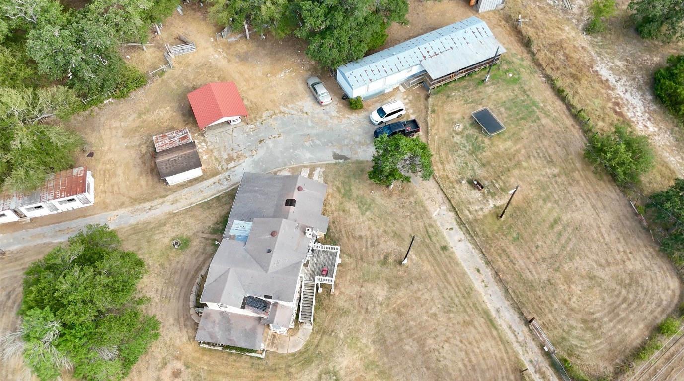 109 Wayside Drive Elgin, TX 78621 - Photo 27 of 31 an aerial view of a house with a yard and trees
